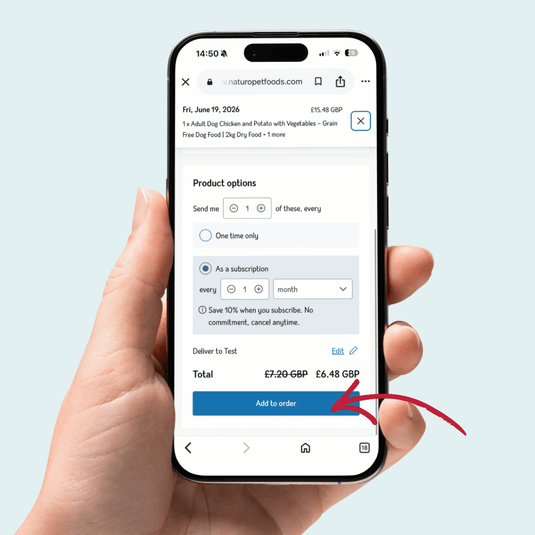 Hand holding a smartphone displaying a pet food ordering app with a subscription option.
